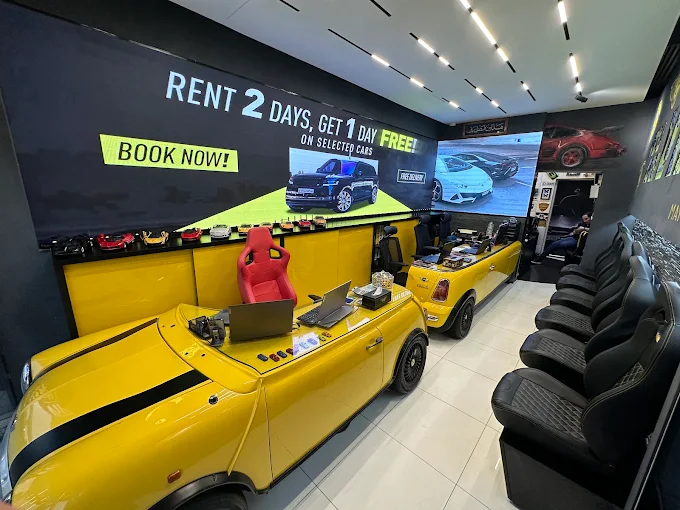 Luxury car rental showroom with yellow sports cars and racing seats.